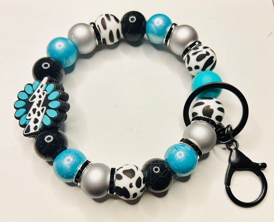 Turquoise Cow Wristlet